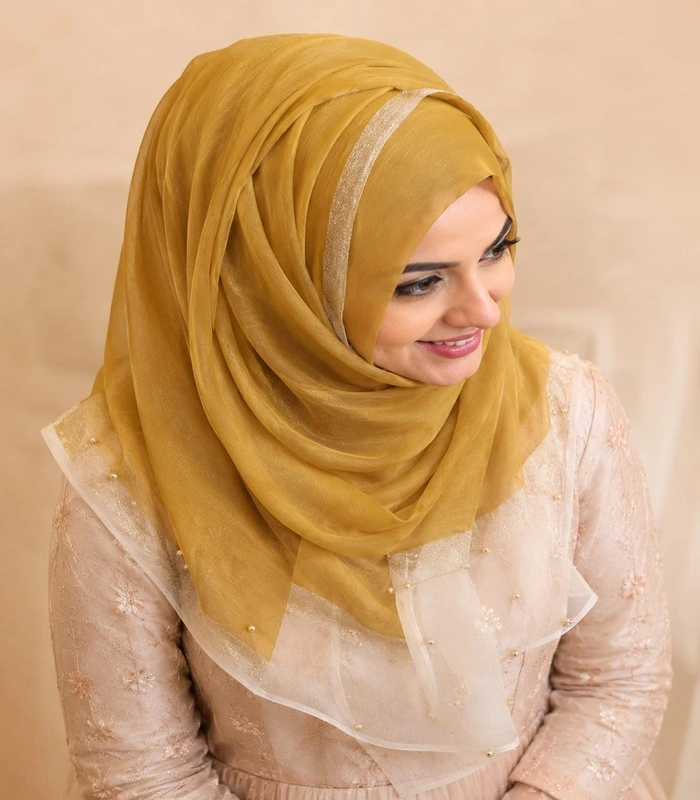 WhatsAppImage2026-07-08at18.47.102_700x800 Premium Mustard Gold Shimmer Border Silk-Finish Hijab - Image 1
